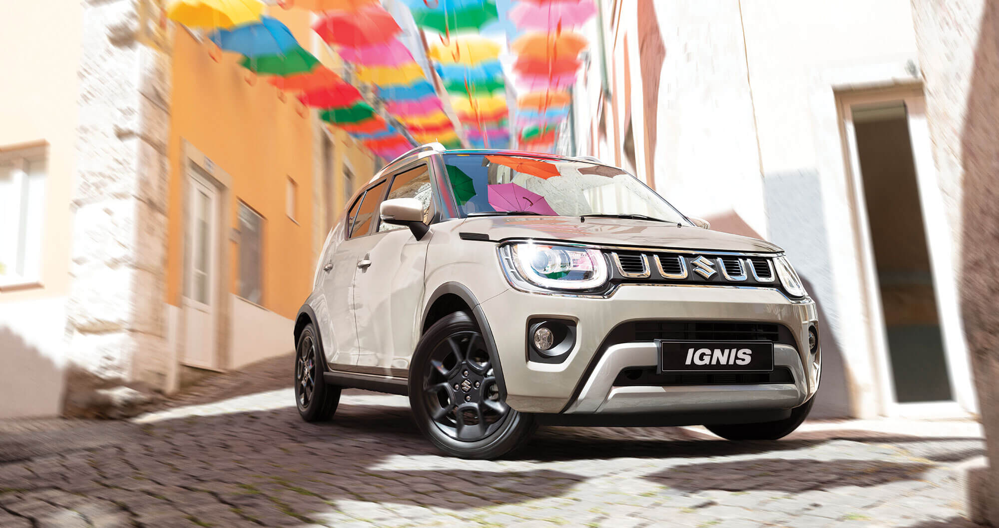 Suzuki Ignis parked on cobblestone road